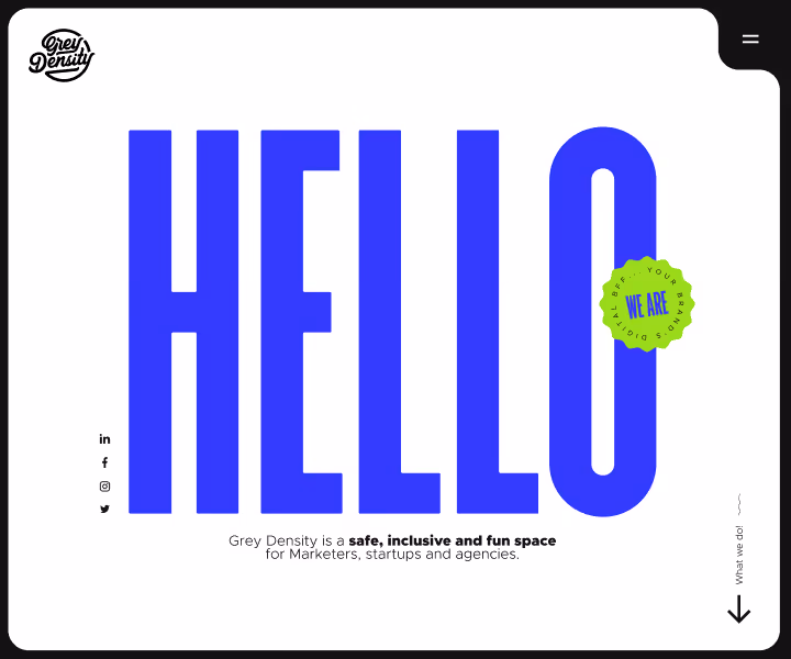 Website homepage showing large blue text 'HELLO' with a small green badge that says 'WE ARE' and tagline stating Grey Density is a safe, inclusive, and fun space for marketers, startups, and agencies.
